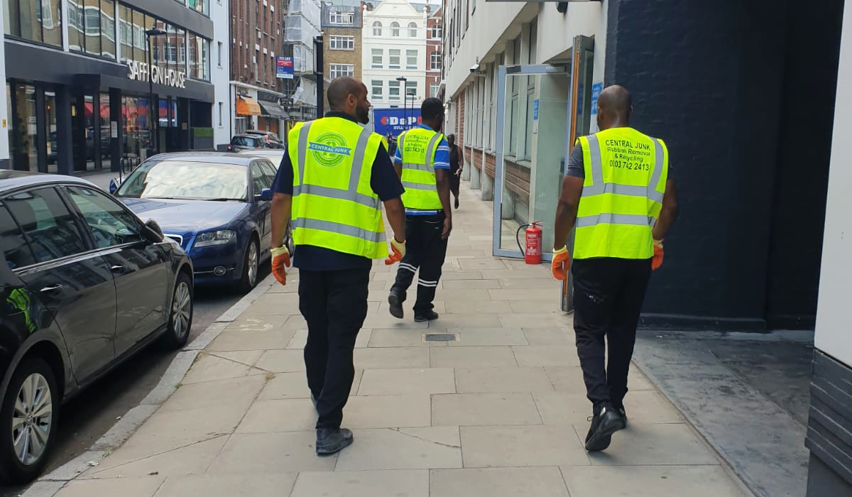 rubbish removal men with vans on a job in london hatton garden