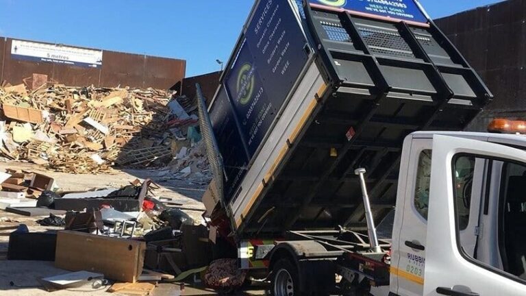 a image of a rubbish removal truck disposing waste